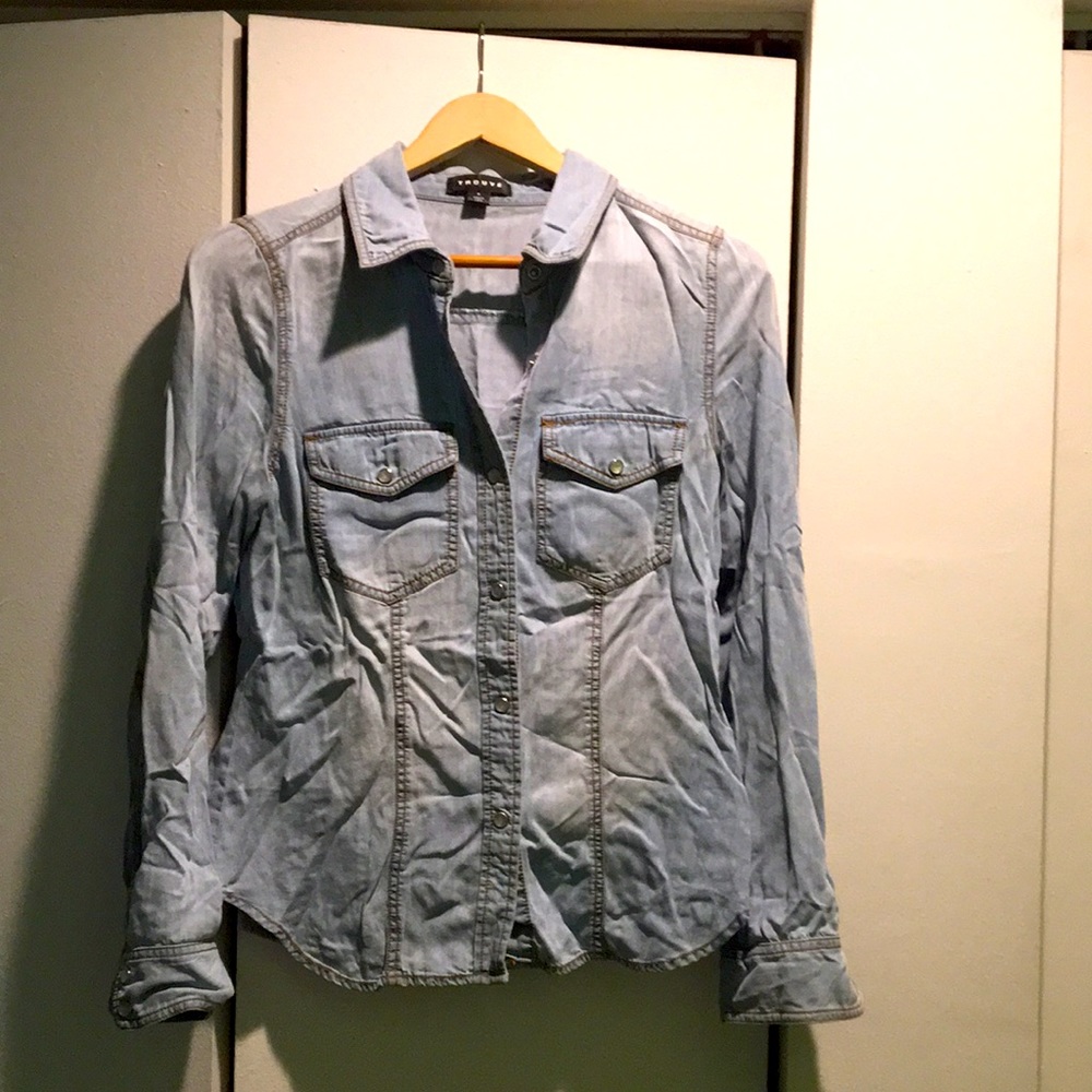 Long sleeved small light denim top with pearl snap buttons